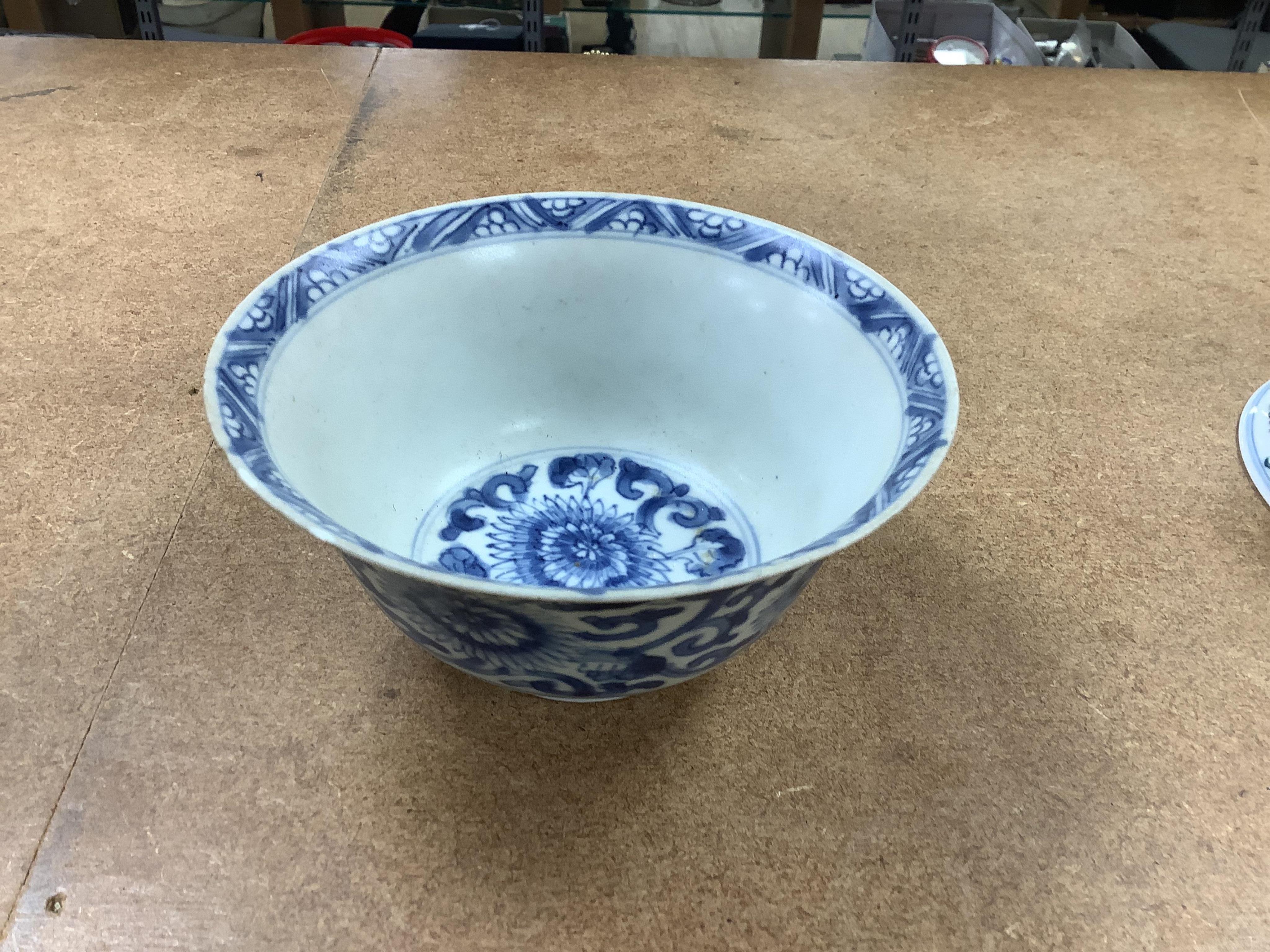 A Chinese blue and white bowl, Kangxi, 15cm. diam., a famille rose teapot stand, Yongzheng, and two doucai bowls. Condition - varies